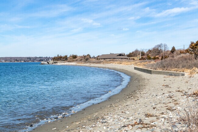 Calm surf and soft sand at Fort Getty Beach in Beavertail.