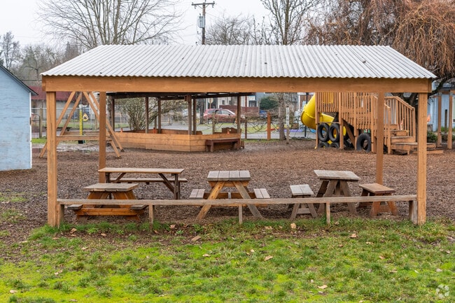 Far Horizons Montessori School has covered outdoor tables for students to sit at in Eugene.