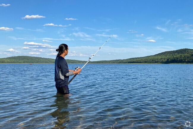 Visitors enjoy kayaking and fishing on the clear waters of Round Valley Reservoir.