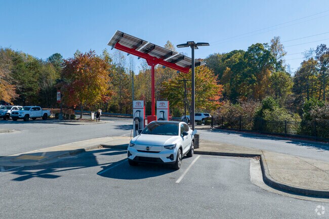 Locals fuel up at the local EV charging station in Hootstown.