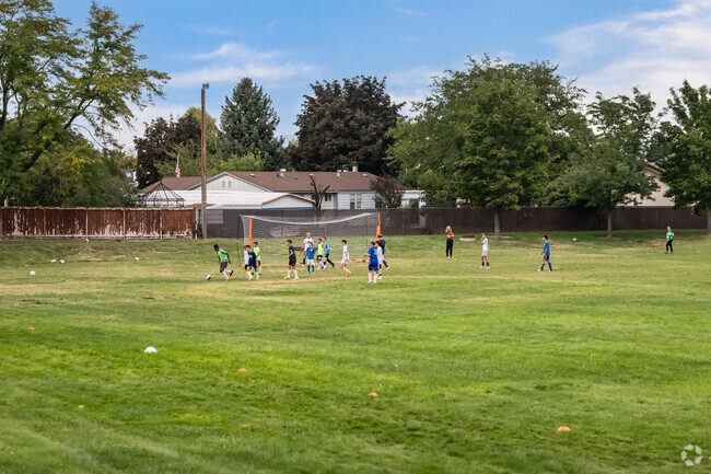 Youth play soccer at Stonehaven Park.