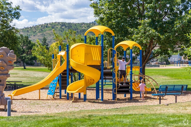Children can explore the bright yellow and blue playset at Timothy M. Mossbrucker Memorial Park.