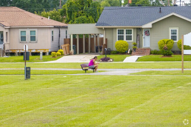 Madison Park features a walking track, playground and shaded benches for West End residents.