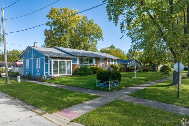 Modern blue ranch style home that is common in Ford Heights, IL.