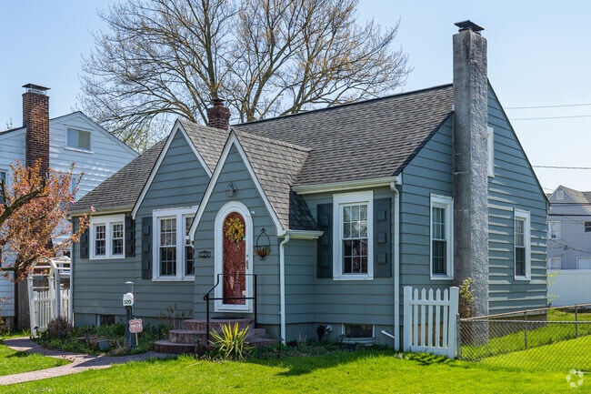 Modern bungalow home on Commonwealth Ave in Claymont featuring a small yard.