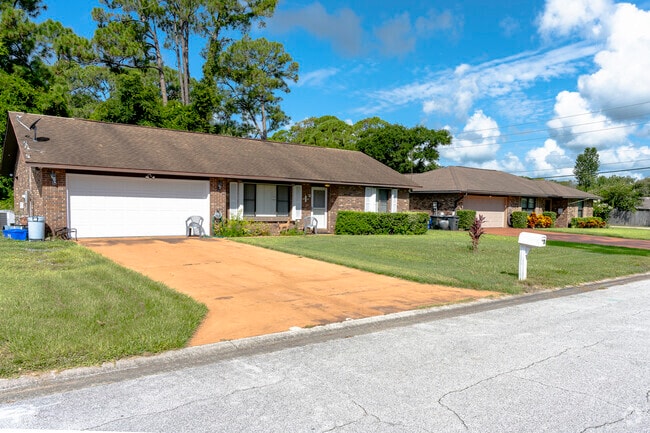 This row of modest single-family Central Park homes neatly line the street.