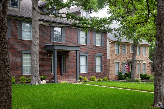 National-style homes line a quiet street in Circle C Ranch.
