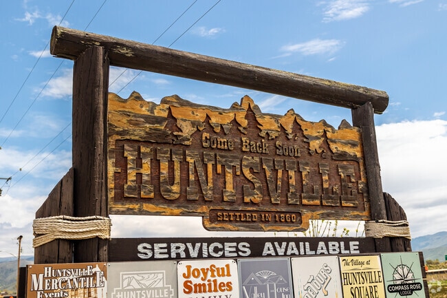 Huntsville's hand-carved rustic sign welcomes visitors to the community.
