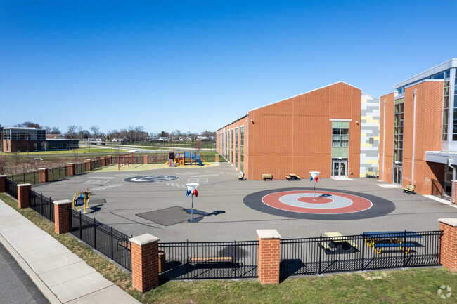 Mill Creek Elementary School side playground area in Levittown.