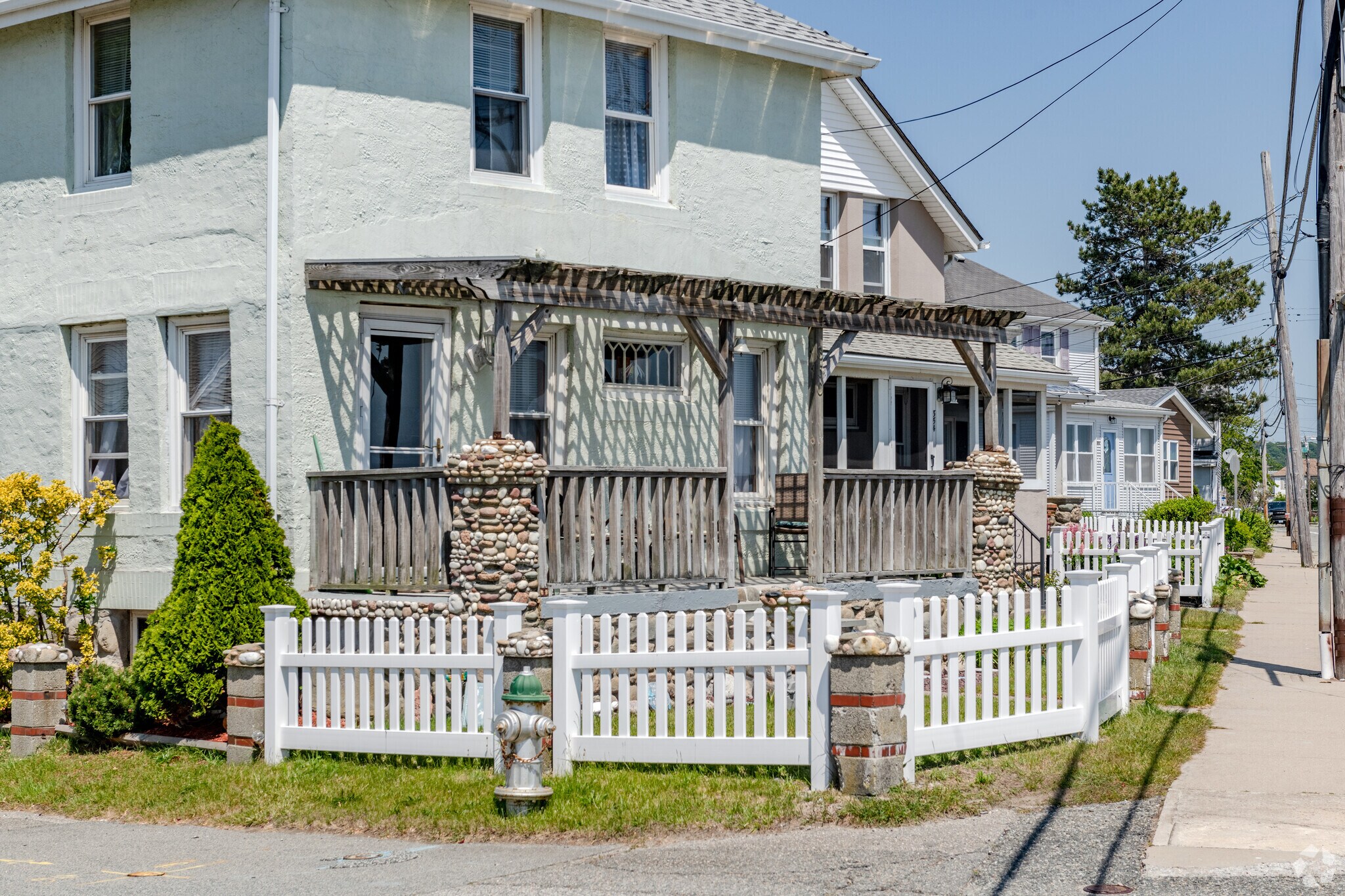 Graceful stonework buttresses this home and others in the Island Park neighborhood.
