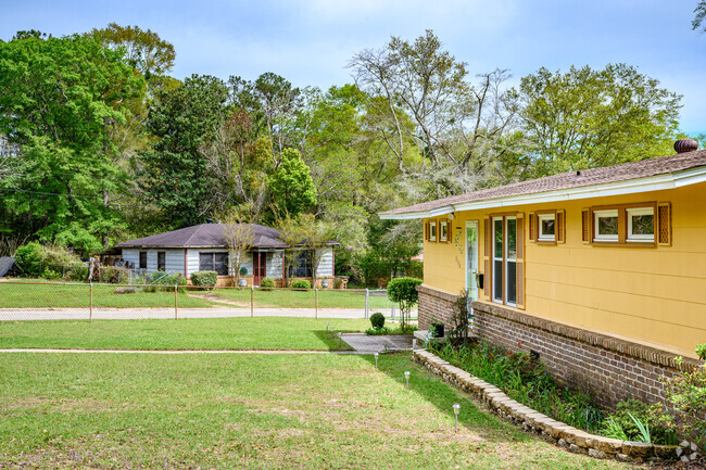 A row of different style homes in Autumndale with large yards.