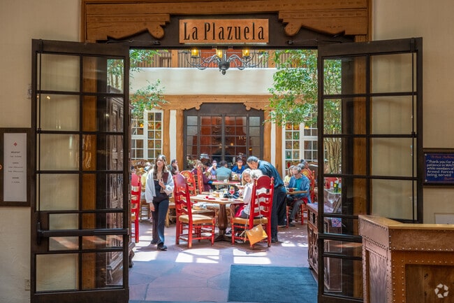 Enjoy gourmet a lunch or dinner at La Plazuela located inside of the historic La Fonda Hotel.