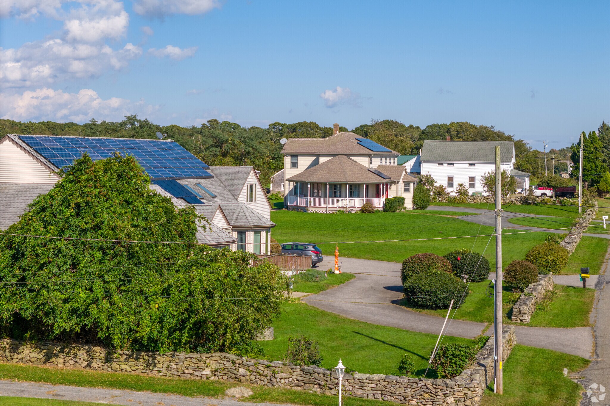 In the Adamsville neighborhood of Westport many homes are delineated by elegant stone fences.