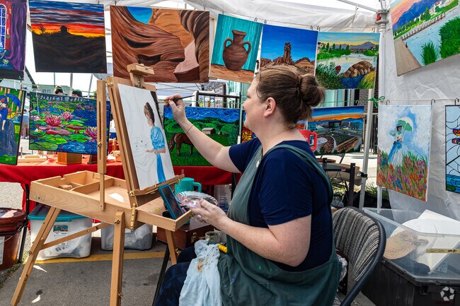 A local artist displays her talent at Daybreak Farmer’s Market.