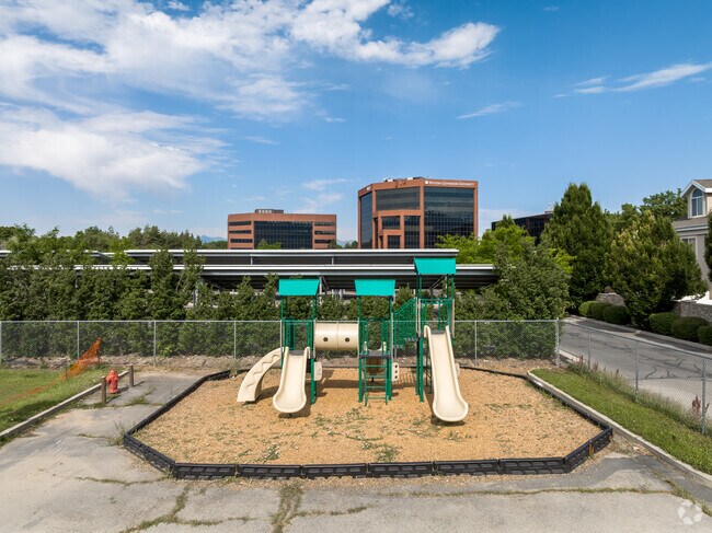 A green and beige playground at Summit Christian Academy in Mount Olympus.
