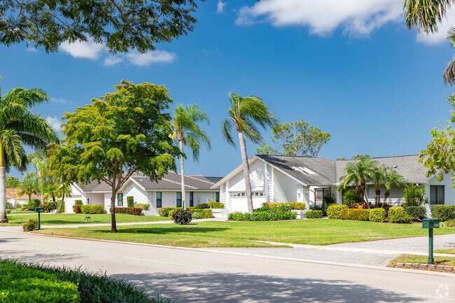 Homes in East Naples include custom single family homes with nicely manicured lawns.