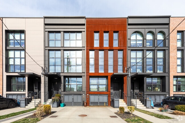 A sleek, modern residential building graces Red Hook's skyline.