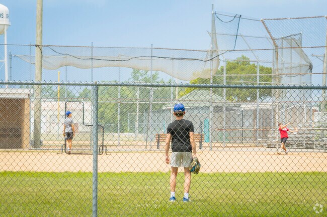 Stadium Park features diamonds where these kids are practicing their baseball skills.