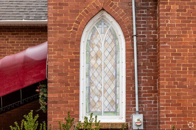 Ornate stained glass sits in a window of the First Presbyterian Church in Prairie Grove.