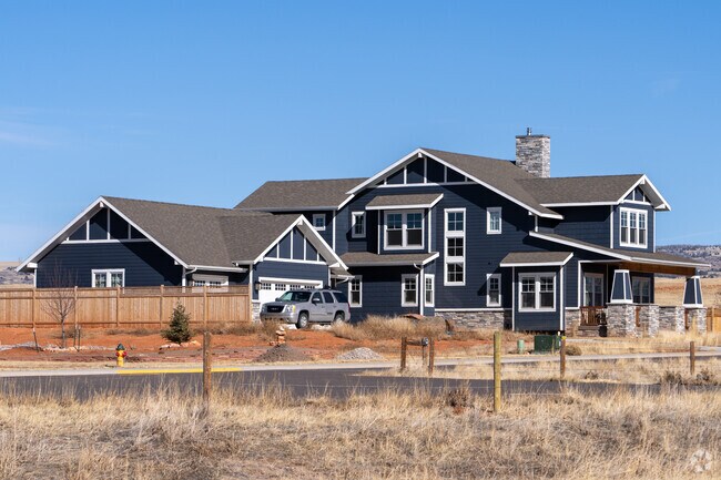 A striking modern Craftsman home in Laramie, blending rustic charm with contemporary design.