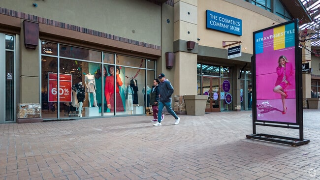 A couple enjoys a day of shopping at Outlets at Traverse Mountain  in Thanksgiving.