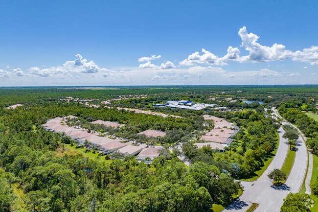 Aerial overview of Lost Lake and its single-family homes, many with terracotta roofs.