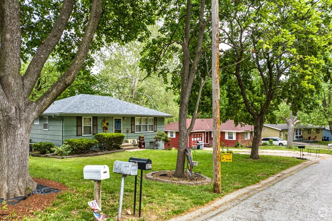 Chouteau Estates community is shaded by trees.