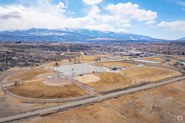 Deerfield Park in Rifle, Colorado, is a hub for sports and outdoor fun, featuring baseball fields, soccer pitches, and a skate park. With scenic mountain views and plenty of space for play, it's the perfect spot for families, athletes, and nature lovers to enjoy the great outdoors.