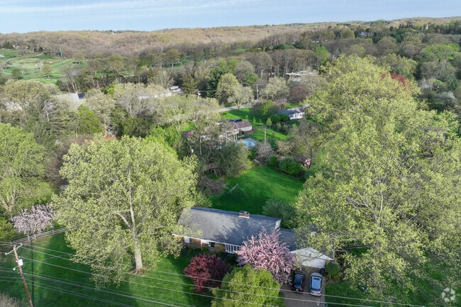 Fox Chapel has many trees lining home owners property.