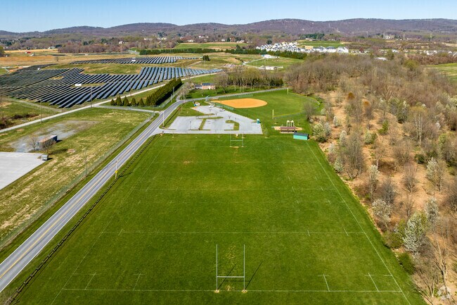 A baseball field and a much larger football field are available for practice games at Walnut Ridge Park.