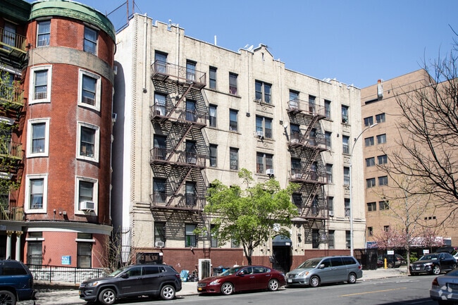 Post-War walkup buildings has affordable and spacious living in Morrisania's urban landscape.