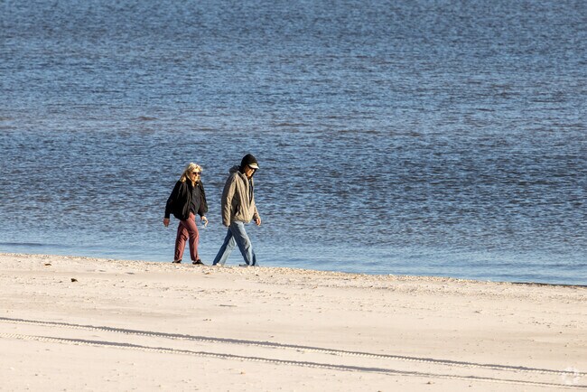A local Pass Christian couple enjoy taking evening walks along the beach.
