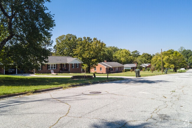 The houses have large, well-kept yards in the Erwin Heights neighborhood.