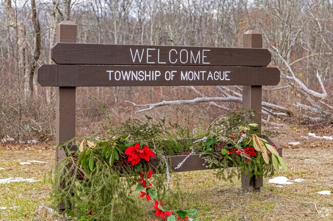 A seasonally decorated sign welcomes you at the entrance of Montague, NJ.