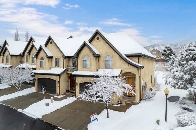 Townhomes in varied styles line tree‑shaded Millcreek streets.