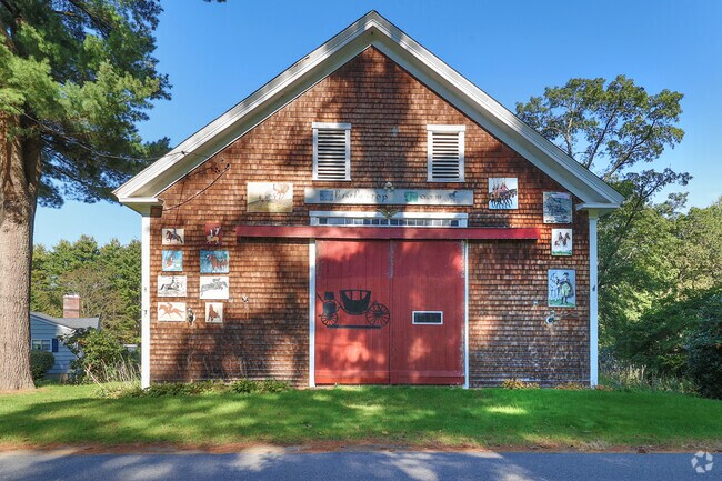 Historic horse barns line Perkins Rowe in Topsfield.