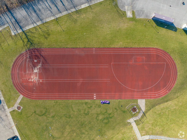 The Aiken High School has a track field next to the school building.