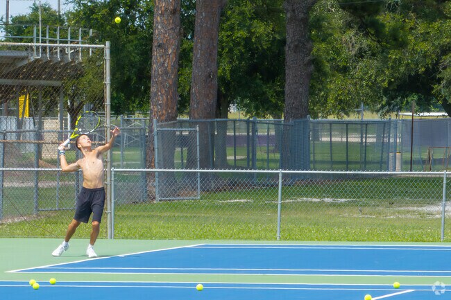 Locals rally for a match on the Jennings Parks tennis courts.