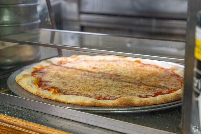 Pick up a fresh cooked pizza at The Heart of Sicily, a local favorite in Emigsville.