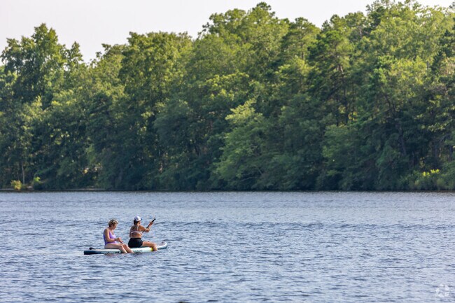 Paddleboard out on the lake with friends at Lake Lenape Park.