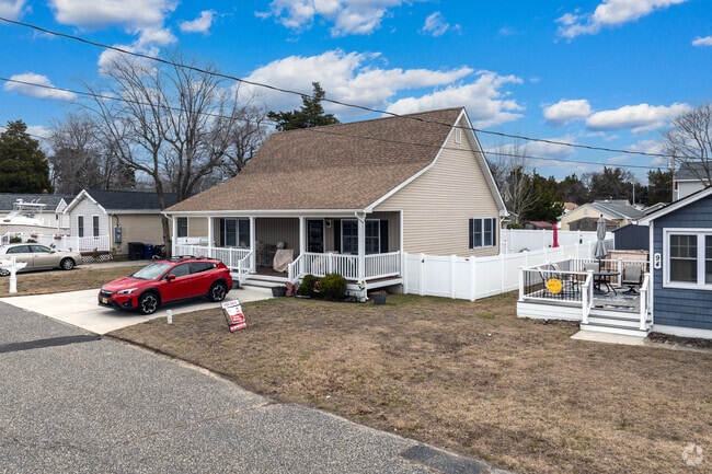 This newly built cape cod home in the Villas has a nice fenced in yard and is within walking distance to the beach a few blocks away.