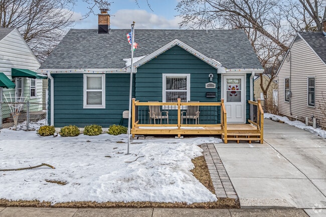 A charming ranch-style home looks cozy in the snow in Island Park.