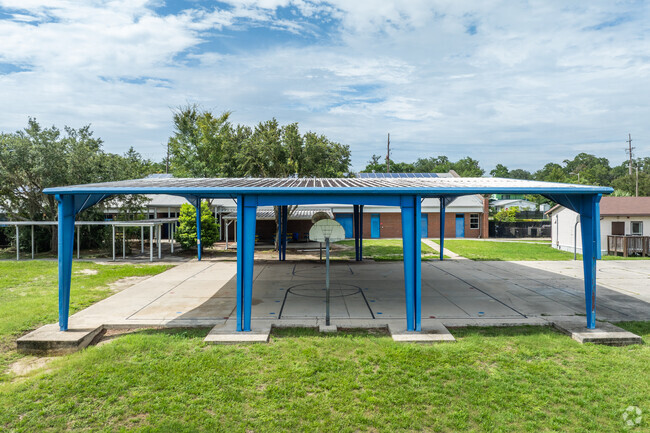 Kids enjoy four square under the pavilion at Joseph Williams Elementary School.