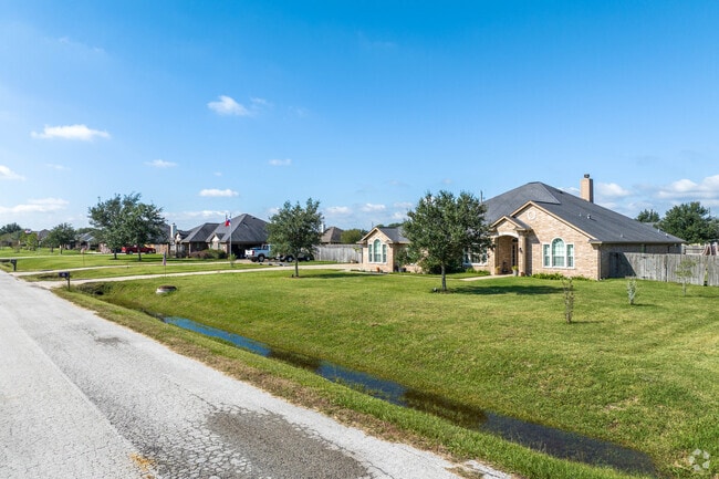 Ranch-style homes line a quiet street near Damon.