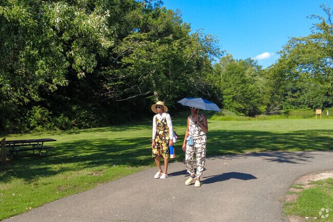 Residents enjoy taking walks at Duke Island Park in Bradley Gardens.