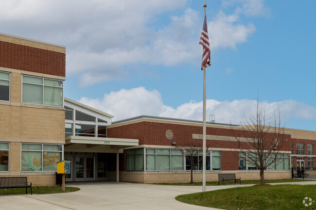 William Rainey Harper School’s brick exterior, a symbol of enduring education, stands proudly.