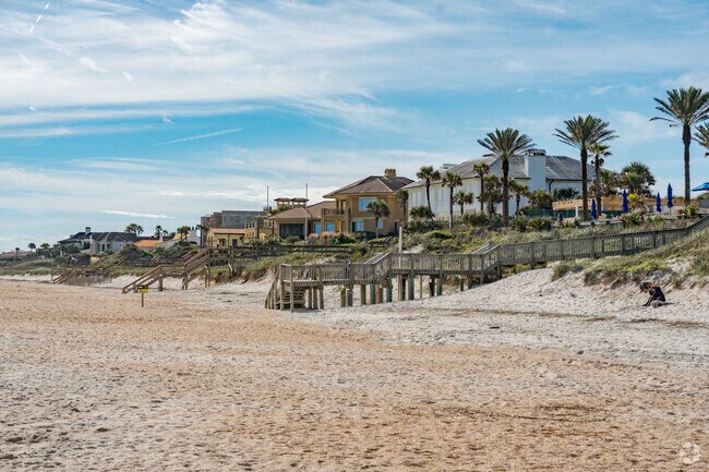 Many of the beachfront homes offer lush landscaping and access to the beach.