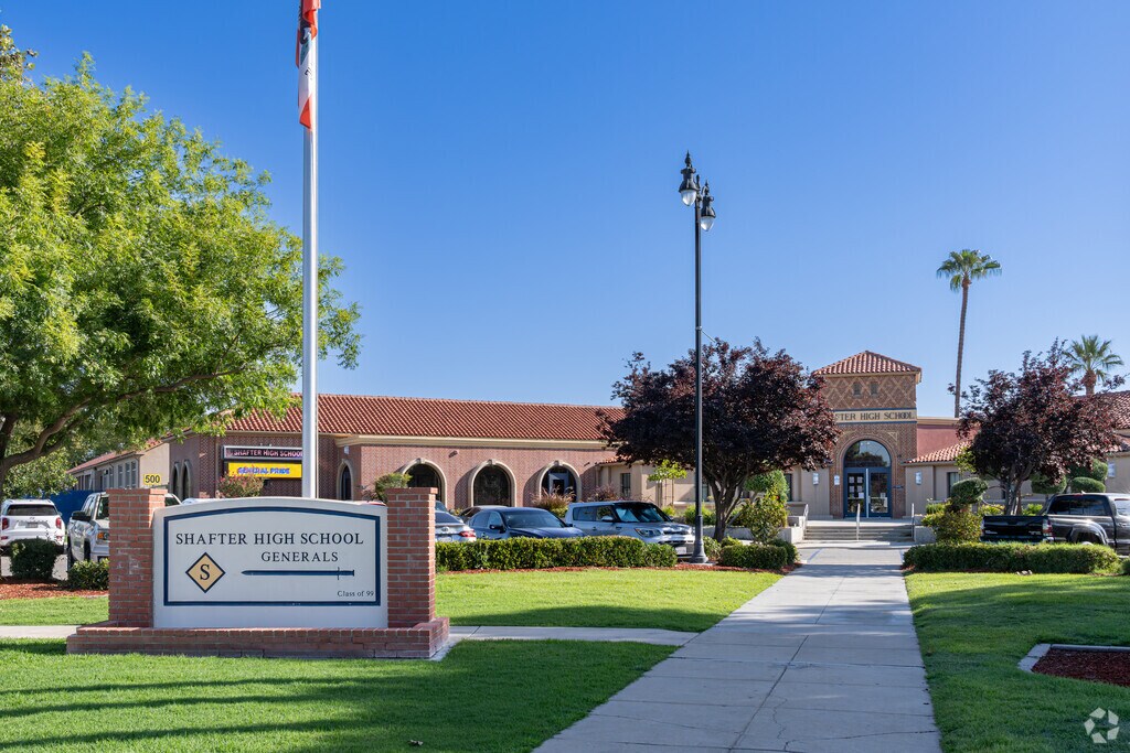 An American flag waves at the entrance to Shafter High School.