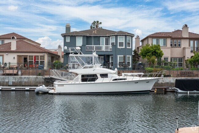 A nice boat sits in a private dock in Channel Islands.