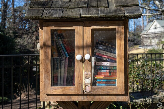 Castlewood Triangle Park features a free little library for neighbors to share books.